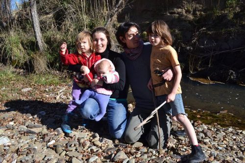 group photo of a family beside a creek