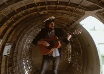 me playing guitar in a C-47