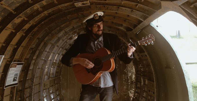 me playing guitar in a C-47